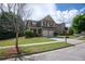 Charming two-story home featuring a well-manicured lawn and a two-car garage, creating an inviting curb appeal at 4271 Haywater Cv, Buford, GA 30519