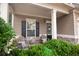 Cozy front porch with comfortable seating, offering a relaxing spot to enjoy the well-maintained landscaping at 4271 Haywater Cv, Buford, GA 30519