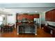 Spacious kitchen features a large island with bar seating, stainless appliances, and eat-in dining area at 4271 Haywater Cv, Buford, GA 30519