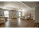 Spacious main bedroom with tray ceilings, ceiling fan, and a large window for plenty of natural light at 4271 Haywater Cv, Buford, GA 30519