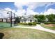 Community tennis court and pool house with manicured landscaping at 4271 Haywater Cv, Buford, GA 30519