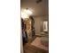 Walk-in closet features shelving, storage and a mirror for added space and convenience at 4271 Haywater Cv, Buford, GA 30519