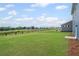 Large backyard features expansive lawn and view of adjacent trees at 107 Cherry Glen Way, Euharlee, GA 30145