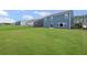 View of spacious backyard featuring ample lawn and the backs of neighboring homes at 107 Cherry Glen Way, Euharlee, GA 30145