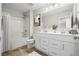 Clean bathroom featuring double vanity sinks, shower-tub combo, and modern fixtures at 107 Cherry Glen Way, Euharlee, GA 30145