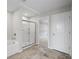 Bathroom with tub, shower, and walk-in closet access at 107 Cherry Glen Way, Euharlee, GA 30145