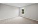 Comfortable bedroom with neutral carpeting, recessed lighting, and a window at 107 Cherry Glen Way, Euharlee, GA 30145