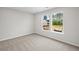 Bedroom with carpet flooring and scenic backyard views at 107 Cherry Glen Way, Euharlee, GA 30145