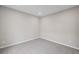 A simple carpeted bedroom with neutral gray walls and electrical outlets at 107 Cherry Glen Way, Euharlee, GA 30145