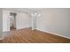 Bright dining room with wood floors and modern chandelier at 107 Cherry Glen Way, Euharlee, GA 30145