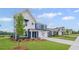Charming two-story home featuring a blue and white exterior with a manicured lawn at 107 Cherry Glen Way, Euharlee, GA 30145