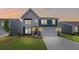 Charming two-story home featuring a blue and white exterior with a manicured lawn at 107 Cherry Glen Way, Euharlee, GA 30145