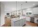 Modern kitchen with stainless steel appliances, granite countertops and center island at 107 Cherry Glen Way, Euharlee, GA 30145