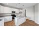 Modern kitchen featuring white cabinets, granite countertops, stainless steel appliances and island at 107 Cherry Glen Way, Euharlee, GA 30145