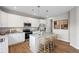 Modern kitchen with stainless steel appliances, white cabinets, granite countertops, and island seating at 107 Cherry Glen Way, Euharlee, GA 30145
