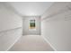 Bright walk-in closet features ample shelving and a window with a view at 107 Cherry Glen Way, Euharlee, GA 30145