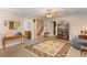 Cozy basement with decorative rug, a sitting area, and access to an upper level at 224 Prominent Loop, Mcdonough, GA 30253