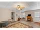 Cozy basement with decorative rug, a fireplace, and access to an outdoor space at 224 Prominent Loop, Mcdonough, GA 30253