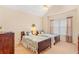Comfortable bedroom featuring two twin beds, neutral walls, carpet, and a ceiling fan at 224 Prominent Loop, Mcdonough, GA 30253
