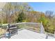 Outdoor deck area perfect for grilling with a serene wooded view at 224 Prominent Loop, Mcdonough, GA 30253