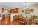 Cozy dining area featuring hardwood floors and a view to the kitchen at 224 Prominent Loop, Mcdonough, GA 30253