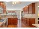 Well-lit kitchen with wood floors, ample counter space, and abundant natural light at 224 Prominent Loop, Mcdonough, GA 30253