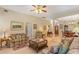 Comfortable living room with cozy furniture, an open floor plan, and carpeted floors at 224 Prominent Loop, Mcdonough, GA 30253