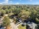 Overhead view of the home surrounded by lush trees, nearby streets, and neighborhood homes at 2442 Connally Dr, East Point, GA 30344