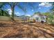 Spacious backyard featuring a wooden deck and a newly constructed wooden fence at 2442 Connally Dr, East Point, GA 30344