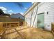 New wooden backyard deck offers outdoor living and entertaining space with access to the yard and house at 2442 Connally Dr, East Point, GA 30344