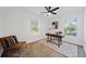 Bright bedroom featuring a modern desk and a cozy accent chair at 2442 Connally Dr, East Point, GA 30344