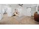 Comfortable bedroom featuring a ceiling fan, barn door, neutral decor, and soft carpet at 2442 Connally Dr, East Point, GA 30344