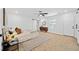 Spacious bedroom with sliding barn door, light filled window, and neutral color scheme at 2442 Connally Dr, East Point, GA 30344