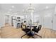 Bright dining area that leads to a modern kitchen featuring stainless steel appliances and updated cabinets at 2442 Connally Dr, East Point, GA 30344