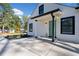 Charming home exterior with a modern paint scheme, black window trim, and inviting entrance at 2442 Connally Dr, East Point, GA 30344