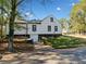 Charming exterior showcasing white siding and a convenient attached garage at 2442 Connally Dr, East Point, GA 30344