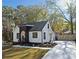 Charming renovated home featuring a modern color scheme, a new driveway and lush landscaping at 2442 Connally Dr, East Point, GA 30344
