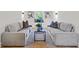 A spacious living room features neutral furniture, a modern coffee table, and wall decor, creating a cozy atmosphere at 2442 Connally Dr, East Point, GA 30344