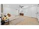 Spacious main bedroom with a ceiling fan, a decorative wood accent wall, and an en-suite bathroom at 2442 Connally Dr, East Point, GA 30344