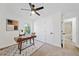 Well-lit office with a mid-century desk, modern decor, and a light carpet at 2442 Connally Dr, East Point, GA 30344