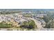 Expansive aerial view showcasing a community with single Gathering homes and streets surrounded by trees at 5247 Flannery Chase Sw, Powder Springs, GA 30127