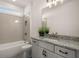 Bright bathroom with granite counters, modern fixtures, and a large mirror at 5247 Flannery Chase Sw, Powder Springs, GA 30127