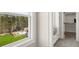 Window view of backyard with pool, playset, and a built-in bench with storage inside the house at 5247 Flannery Chase Sw, Powder Springs, GA 30127