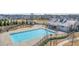 Aerial shot of the community pool area with a large pool, splash pad, and sunbathing area at 5247 Flannery Chase Sw, Powder Springs, GA 30127