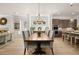 Open floor plan with dining room adjacent to kitchen and living areas at 5247 Flannery Chase Sw, Powder Springs, GA 30127