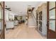 Inviting entryway with staircase, hardwood floors, and decorative display case at 5247 Flannery Chase Sw, Powder Springs, GA 30127