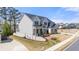 Elegant two-story home featuring stone accents, a covered porch, and a meticulously maintained lawn at 5247 Flannery Chase Sw, Powder Springs, GA 30127