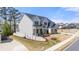 Charming two-story home featuring a landscaped yard, stone accents, and a cozy front porch at 5247 Flannery Chase Sw, Powder Springs, GA 30127