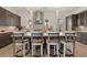 Modern kitchen with an island, a breakfast bar, stainless steel appliances, and pendant lighting at 5247 Flannery Chase Sw, Powder Springs, GA 30127
