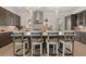 Modern kitchen island with seating and stylish pendant lighting at 5247 Flannery Chase Sw, Powder Springs, GA 30127